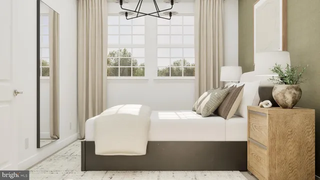 a bedroom with a bed and window