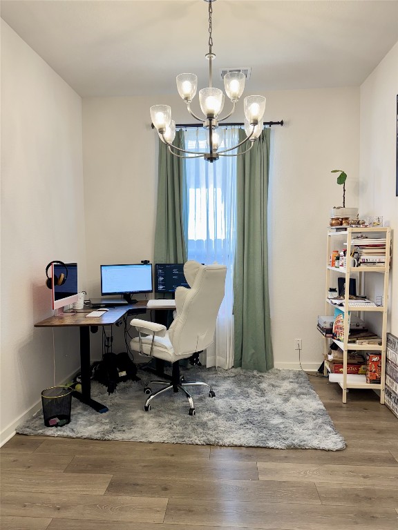 422 Billowing Way Kyle, TX 78640 - Photo 13 of 26 a workspace with furniture wooden floor and a chandelier