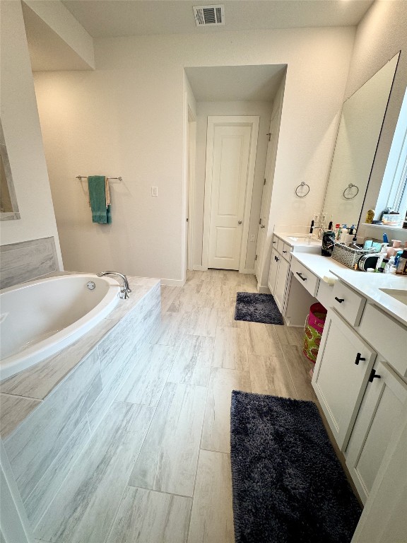 422 Billowing Way Kyle, TX 78640 - Photo 16 of 26 a bathroom with a sink and a mirror