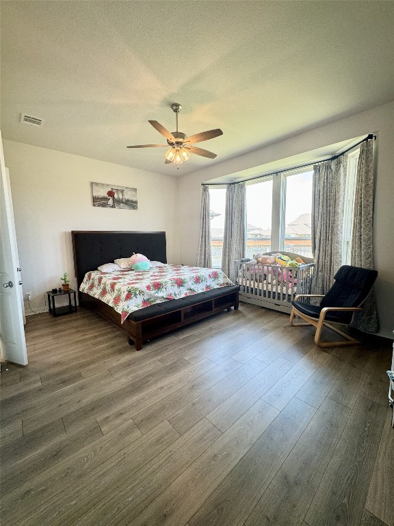 422 Billowing Way Kyle, TX 78640 - Photo 21 of 26 a bedroom with a bed and a couch