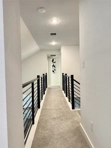 an entryway in a hall with a window