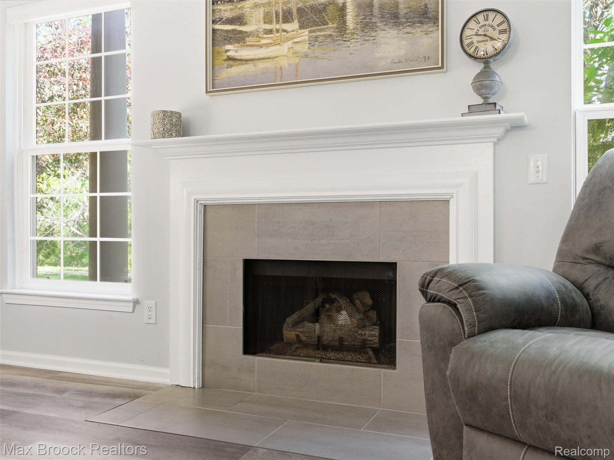3562 Tremonte Circle Rochester, MI 48306 - Photo 8 of 33 Fireplace featuring a white mantel, tile surround, and an integrated firebox