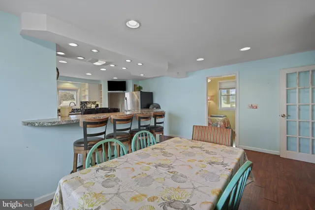 a kitchen with a table and chairs in it