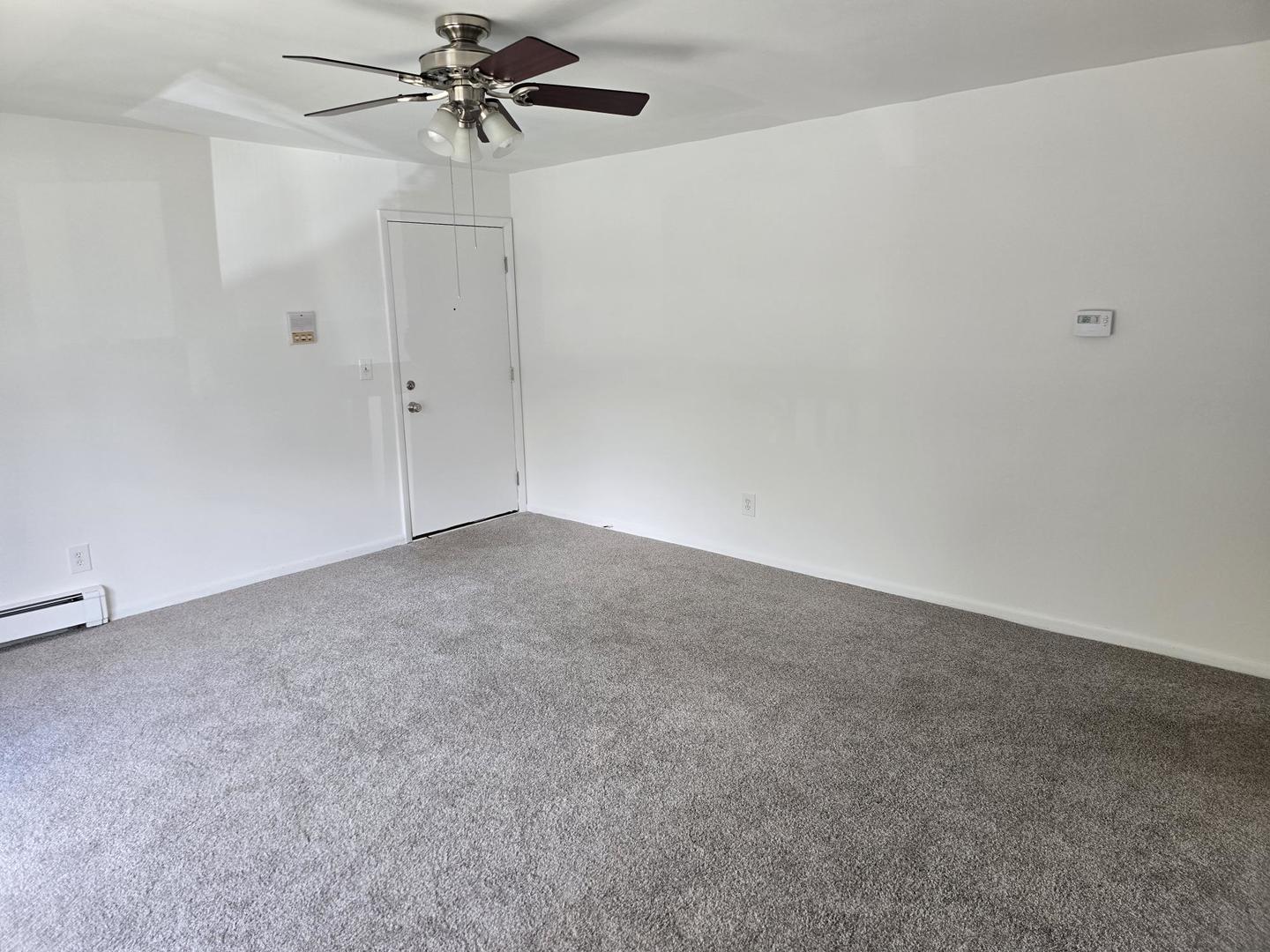 19360 Wolf Road, Unit 1 Mokena, IL 60448 - Photo 2 of 11 a view of a room with a ceiling fan