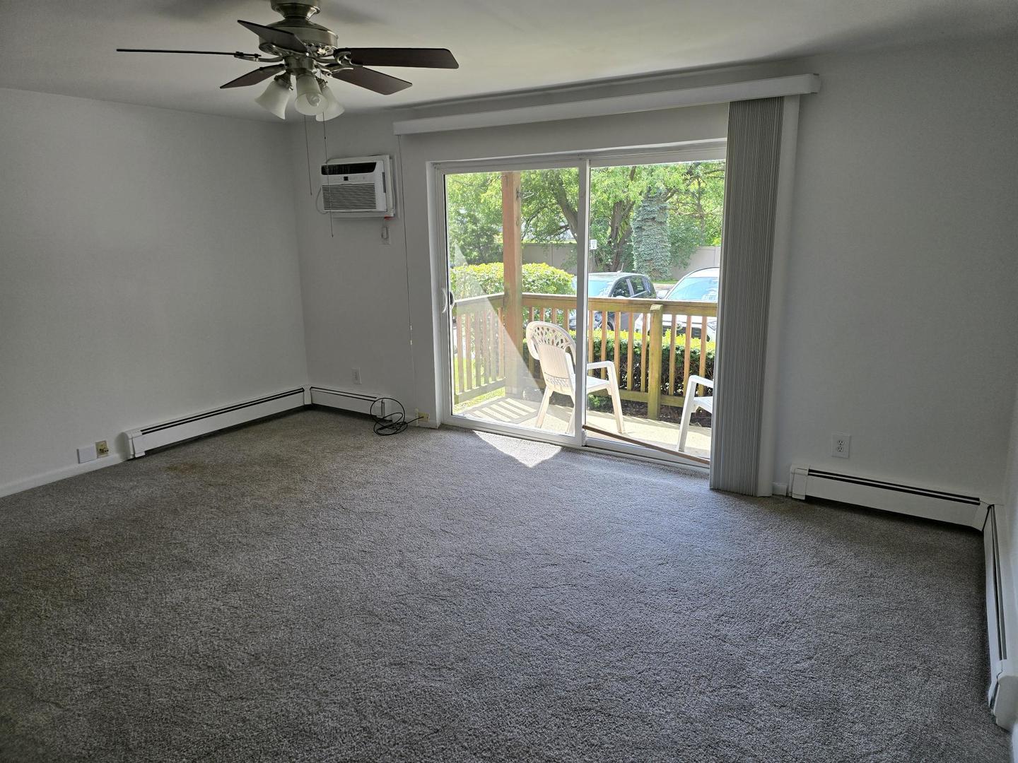 19360 Wolf Road, Unit 1 Mokena, IL 60448 - Photo 3 of 11 a view of an empty room with a window