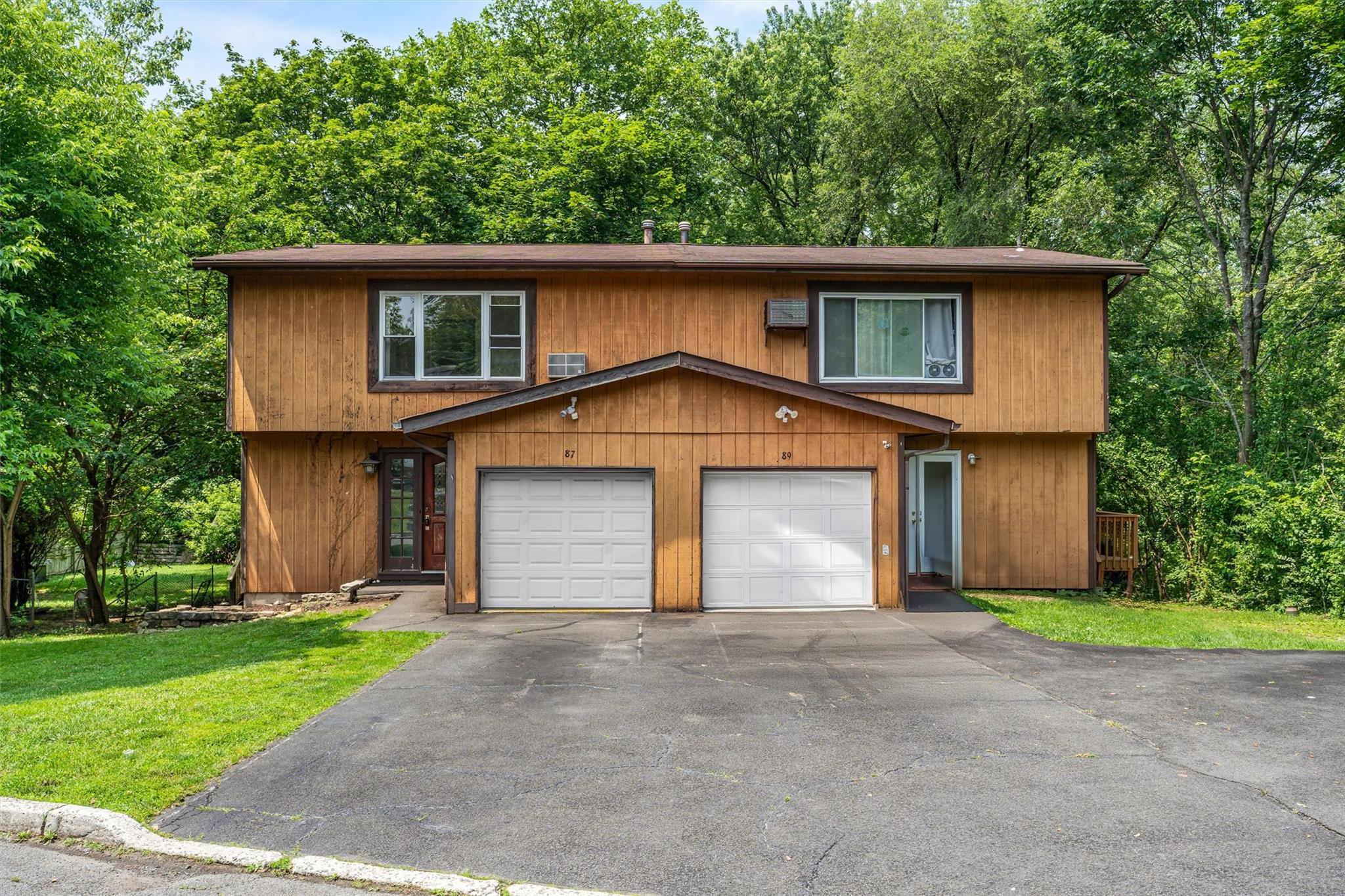 87 North Pascack Road Nanuet, NY 10954 - Photo 1 of 1 Townhome / multi-family property featuring asphalt driveway, a garage, and a front lawn