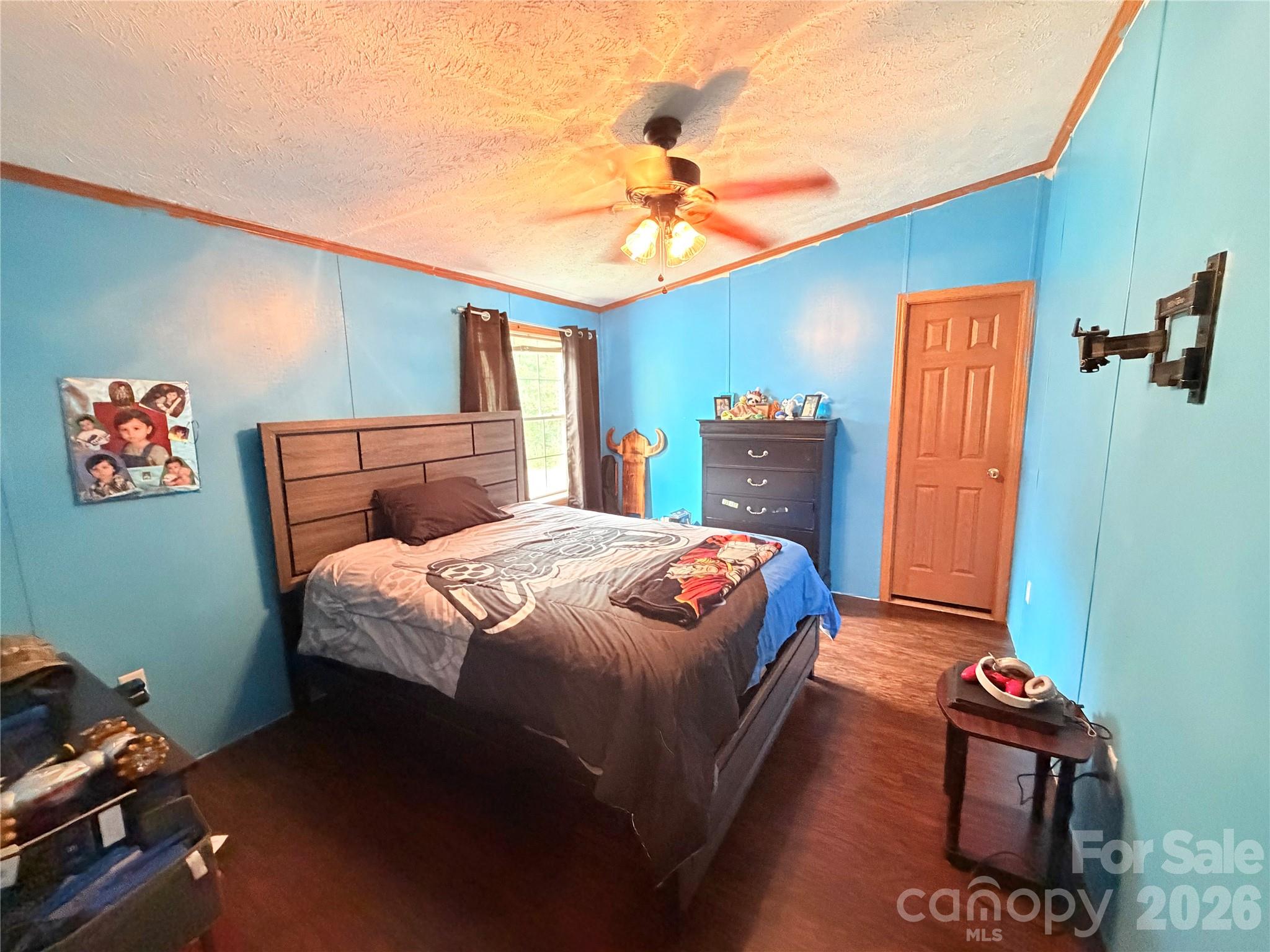 219 John E Randall Road Shelby, NC 28152 - Photo 14 of 21 a bedroom with a bed and a chandelier