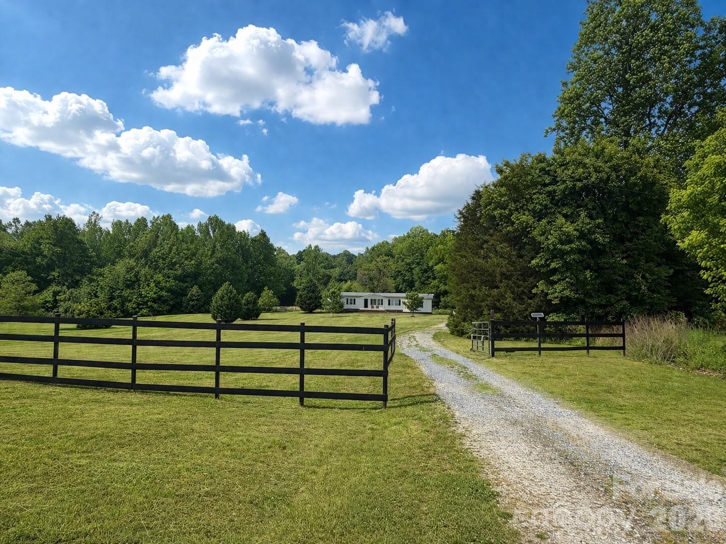 219 John E Randall Road Shelby, NC 28152 - Photo 2 of 21 a view of a bench in a yard