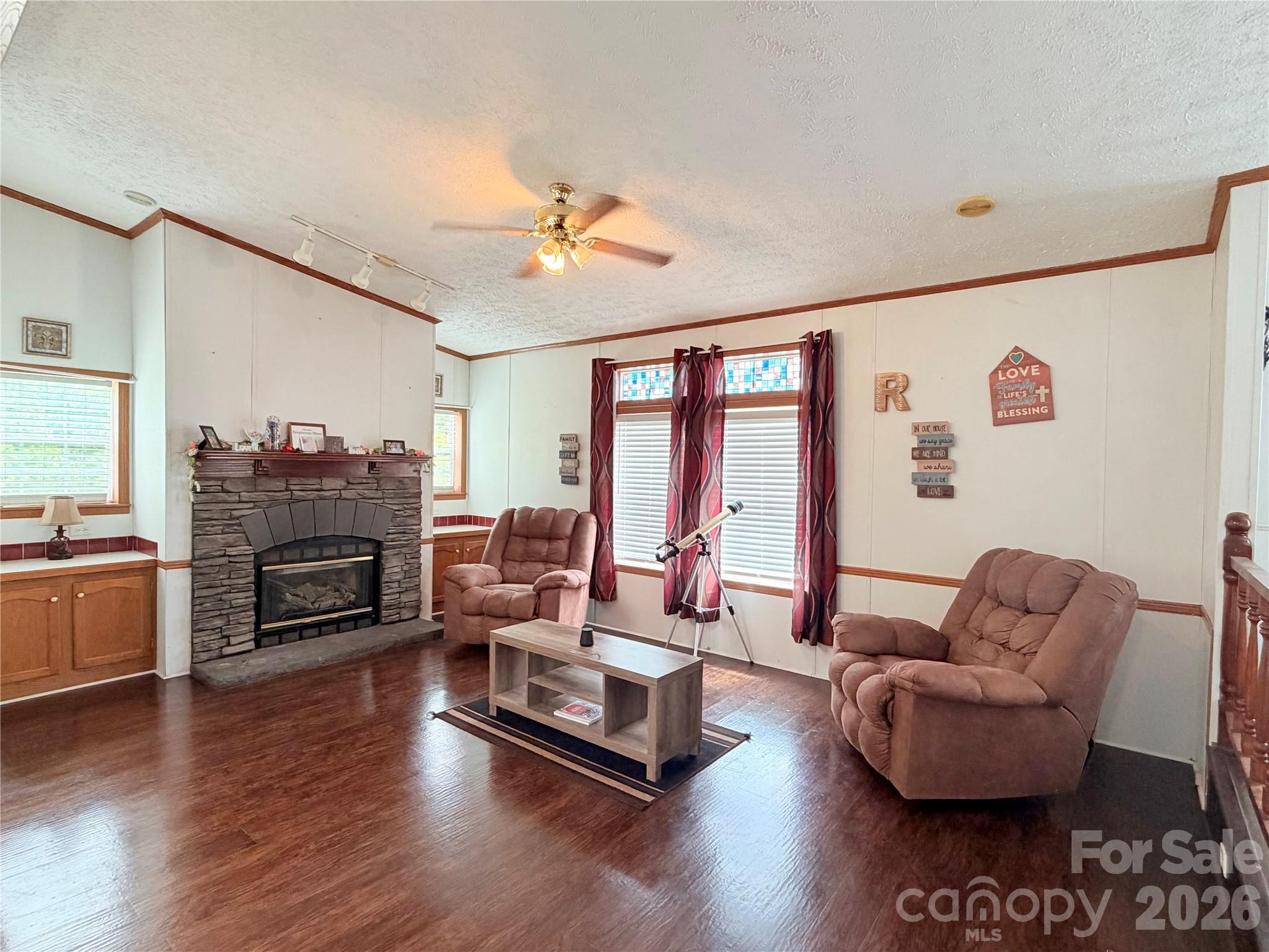 219 John E Randall Road Shelby, NC 28152 - Photo 7 of 21 a living room with furniture and a fireplace
