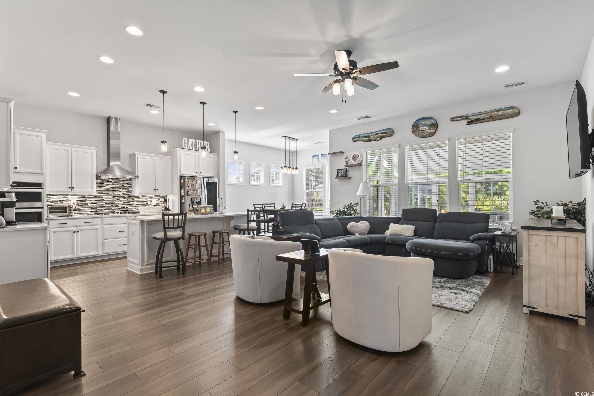 256 Yellow Rail Street Murrells Inlet, SC 29576 - Photo 8 of 40 Living room featuring ceiling fan and dark hardwoo
