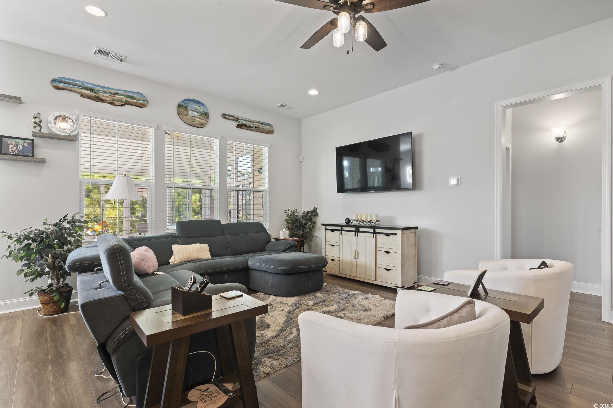 256 Yellow Rail Street Murrells Inlet, SC 29576 - Photo 9 of 40 Living room featuring ceiling fan and dark hardwoo