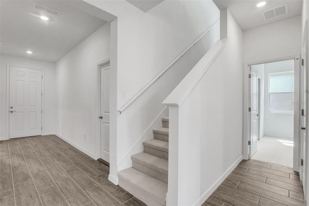35163 Tuscan Hill Road Dade City, FL 33525 - Photo 11 of 45 a view of entryway with wooden floor
