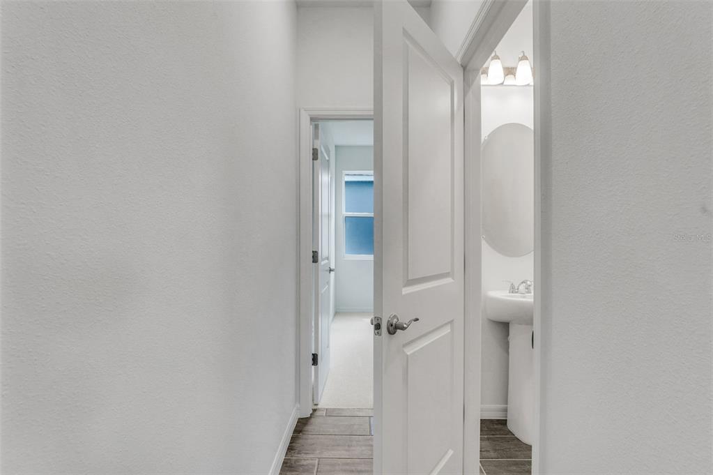 35163 Tuscan Hill Road Dade City, FL 33525 - Photo 13 of 45 a view of a bathroom from a hallway