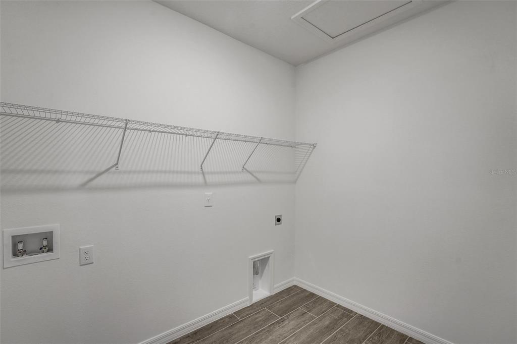 35163 Tuscan Hill Road Dade City, FL 33525 - Photo 22 of 45 a view of a room with racks on the wall
