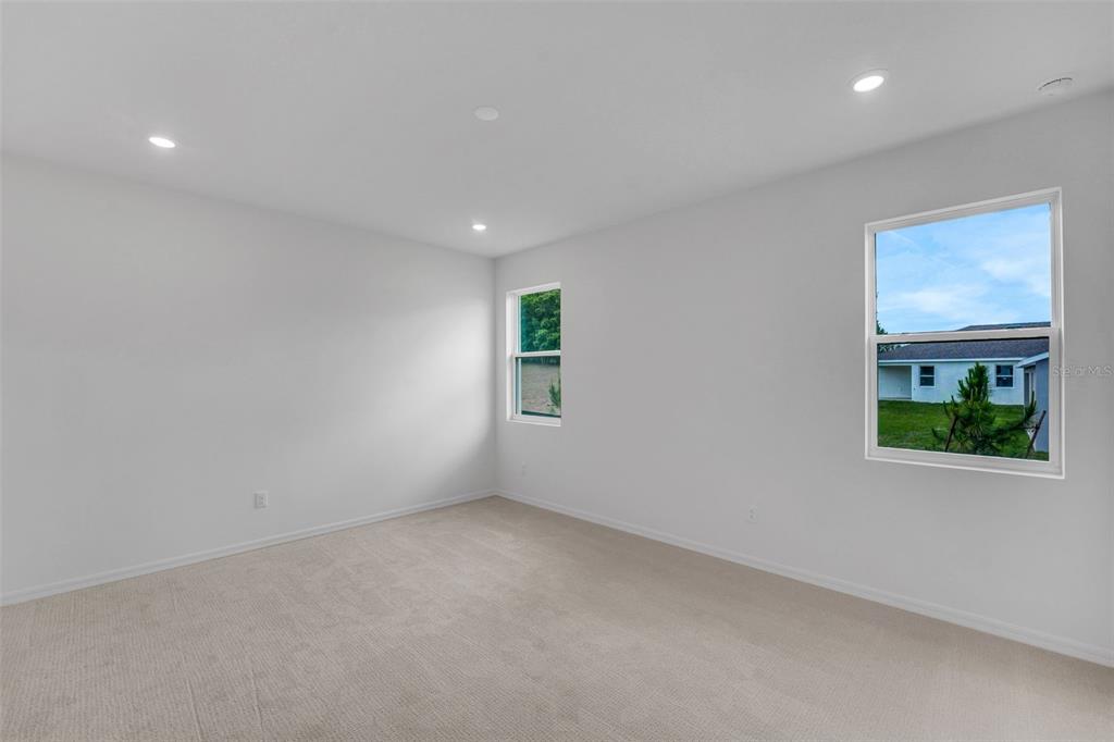 35163 Tuscan Hill Road Dade City, FL 33525 - Photo 29 of 45 an empty room with windows