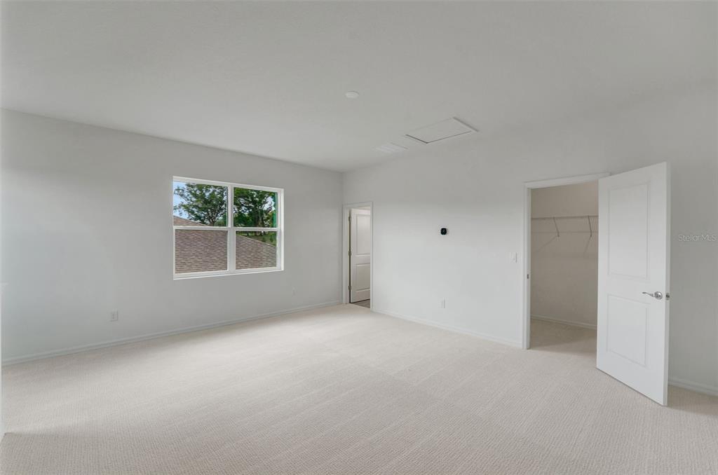 35163 Tuscan Hill Road Dade City, FL 33525 - Photo 37 of 45 an empty room with windows