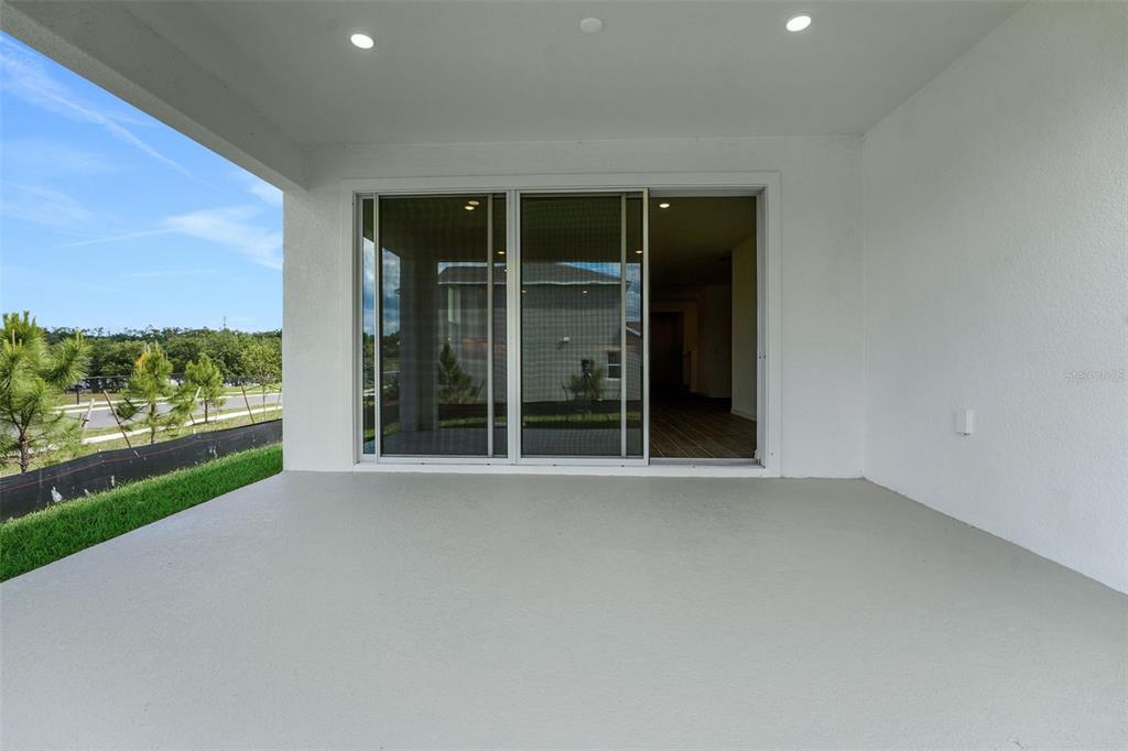 35163 Tuscan Hill Road Dade City, FL 33525 - Photo 40 of 45 a view of an empty room with a balcony