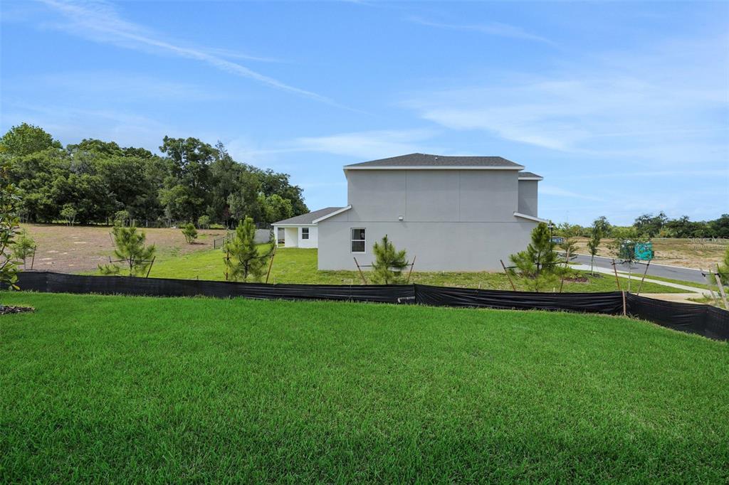 35163 Tuscan Hill Road Dade City, FL 33525 - Photo 42 of 45 a view of a garden and basketball court