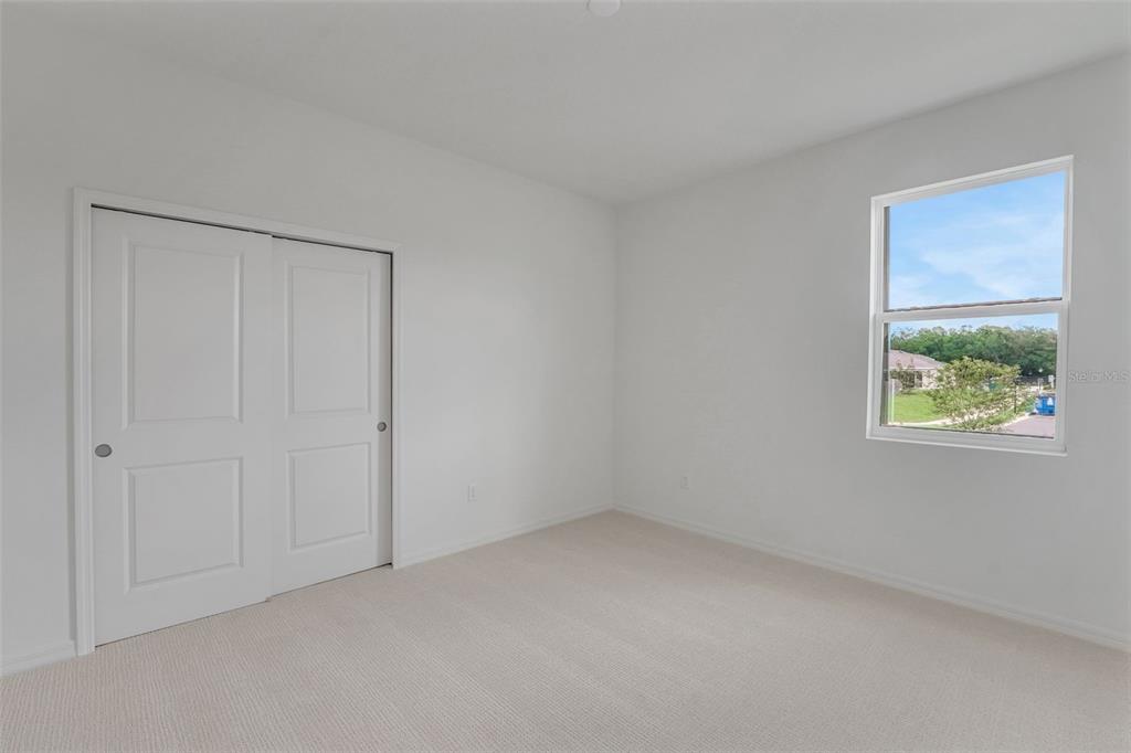 35163 Tuscan Hill Road Dade City, FL 33525 - Photo 6 of 45 a view of an empty room with a window