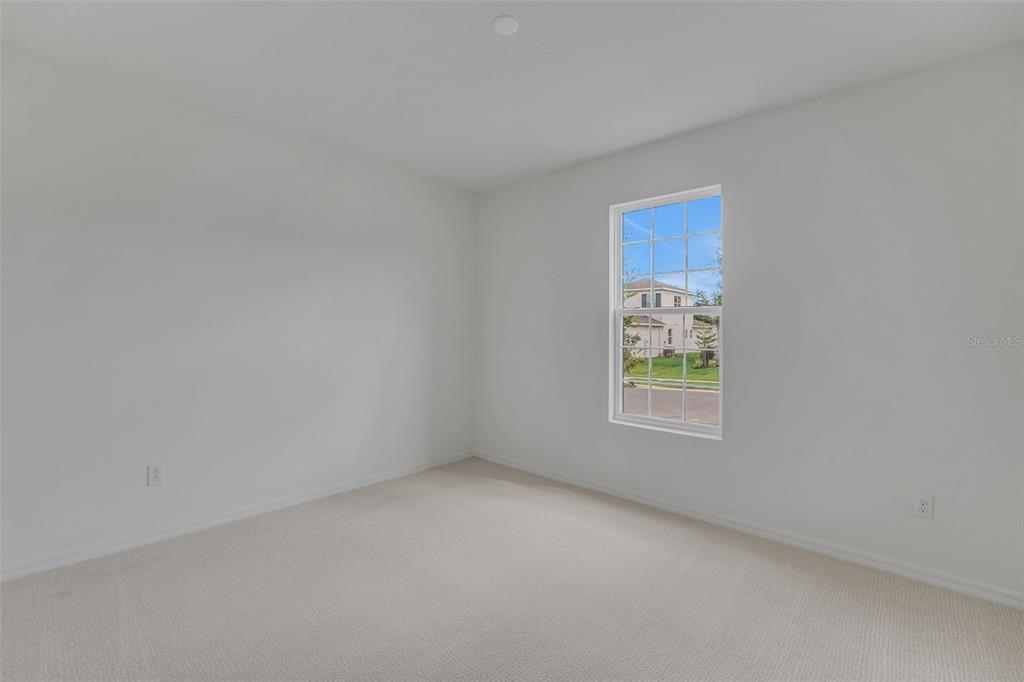 35163 Tuscan Hill Road Dade City, FL 33525 - Photo 8 of 45 a view of an empty room with a window
