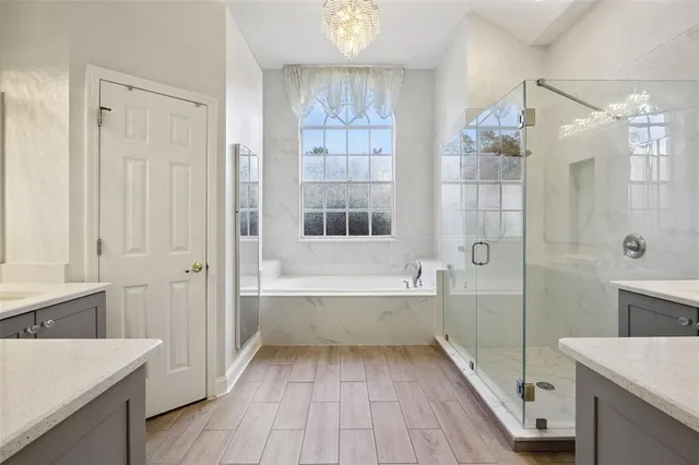 a bathroom with a bathtub and a sink