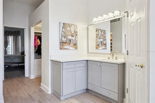 a spacious bathroom with a double vanity sink and a mirror