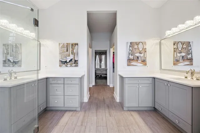 a spacious bathroom with a granite countertop sink toilet and a mirror