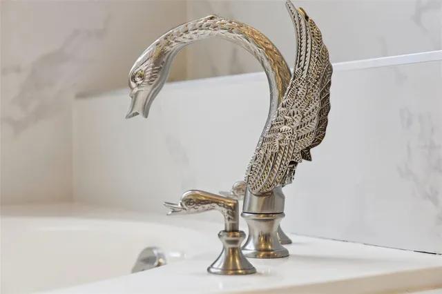 a kitchen with a sink cabinets and refrigerator