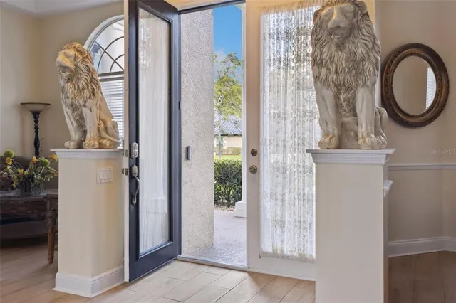a front view of a house with a fountain