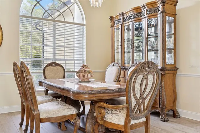 a view of a dining room with furniture and window