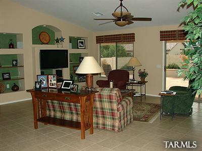 62195 East Northwood Road Tucson, AZ 85739 - Photo 7 of 25 a living room with furniture and a flat screen tv