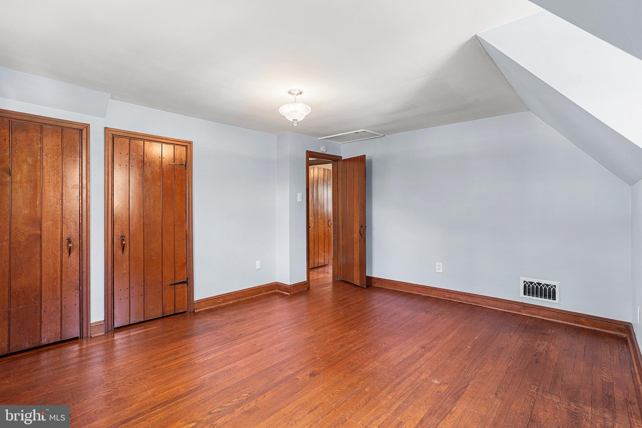 217 East Thomson Avenue Springfield, PA 19064 - Photo 23 of 32 an empty room with wooden floor and closet