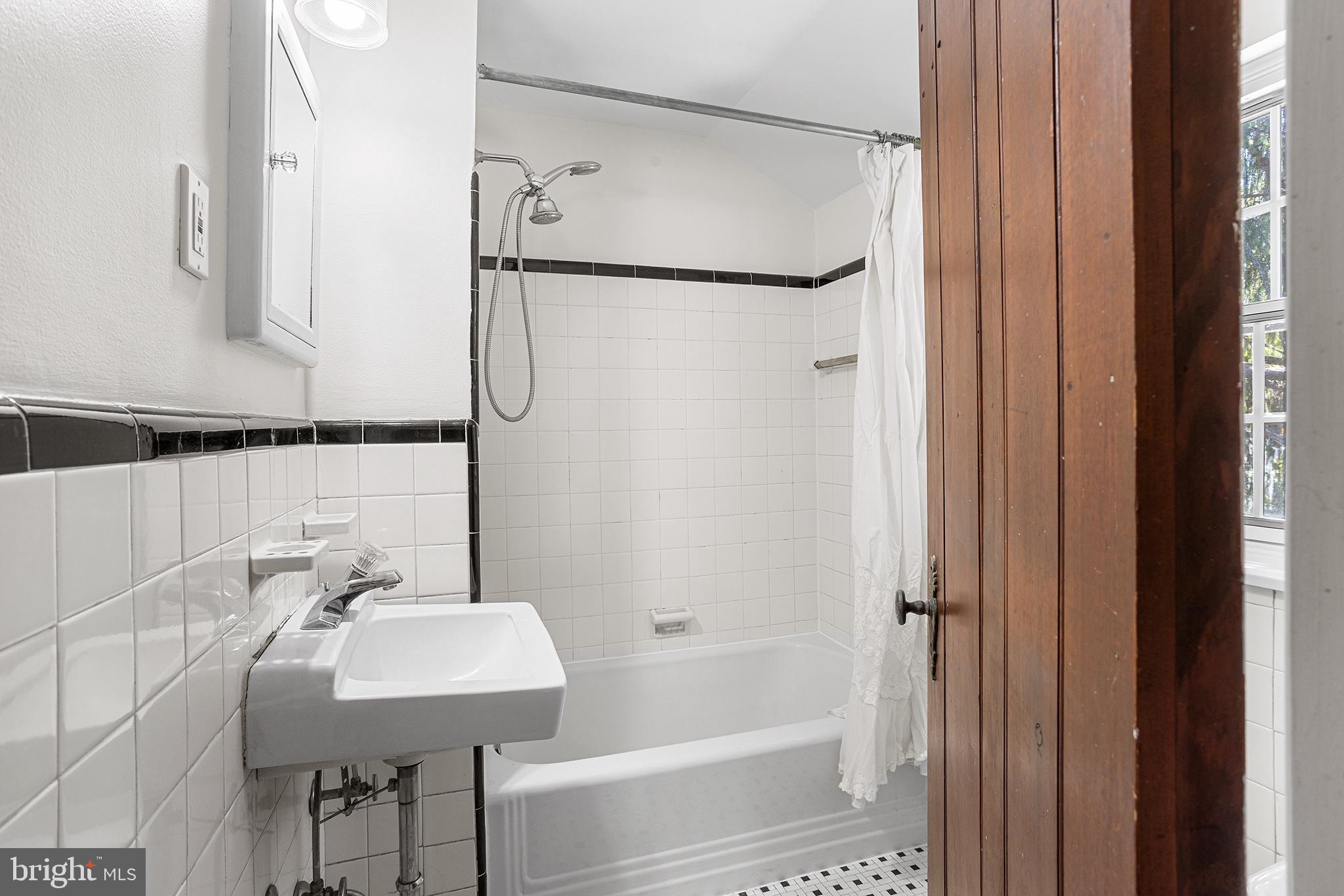 217 East Thomson Avenue Springfield, PA 19064 - Photo 25 of 32 a bathroom with a sink and a mirror
