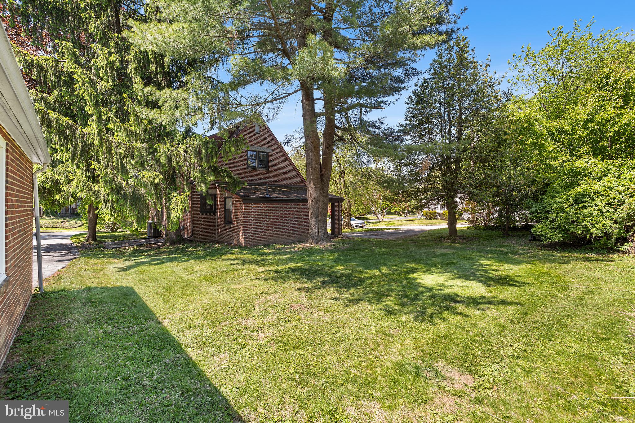 217 East Thomson Avenue Springfield, PA 19064 - Photo 32 of 32 a backyard of a house with lots of green space