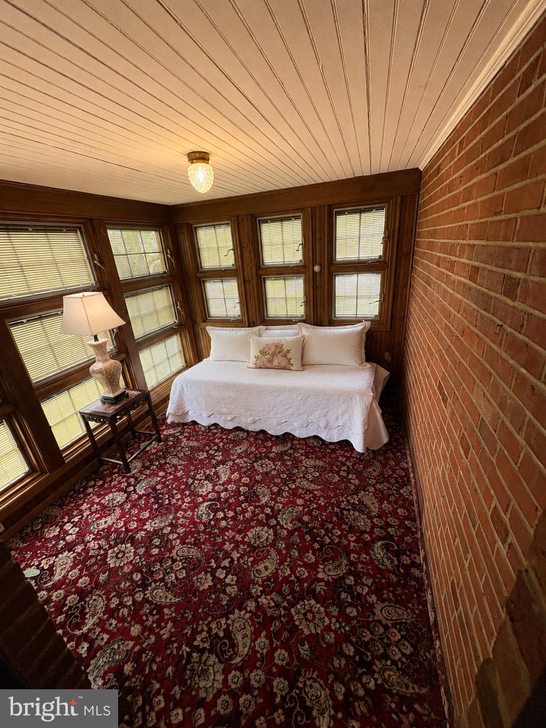 217 East Thomson Avenue Springfield, PA 19064 - Photo 9 of 32 a large bedroom with a bed wooden floor and a large window