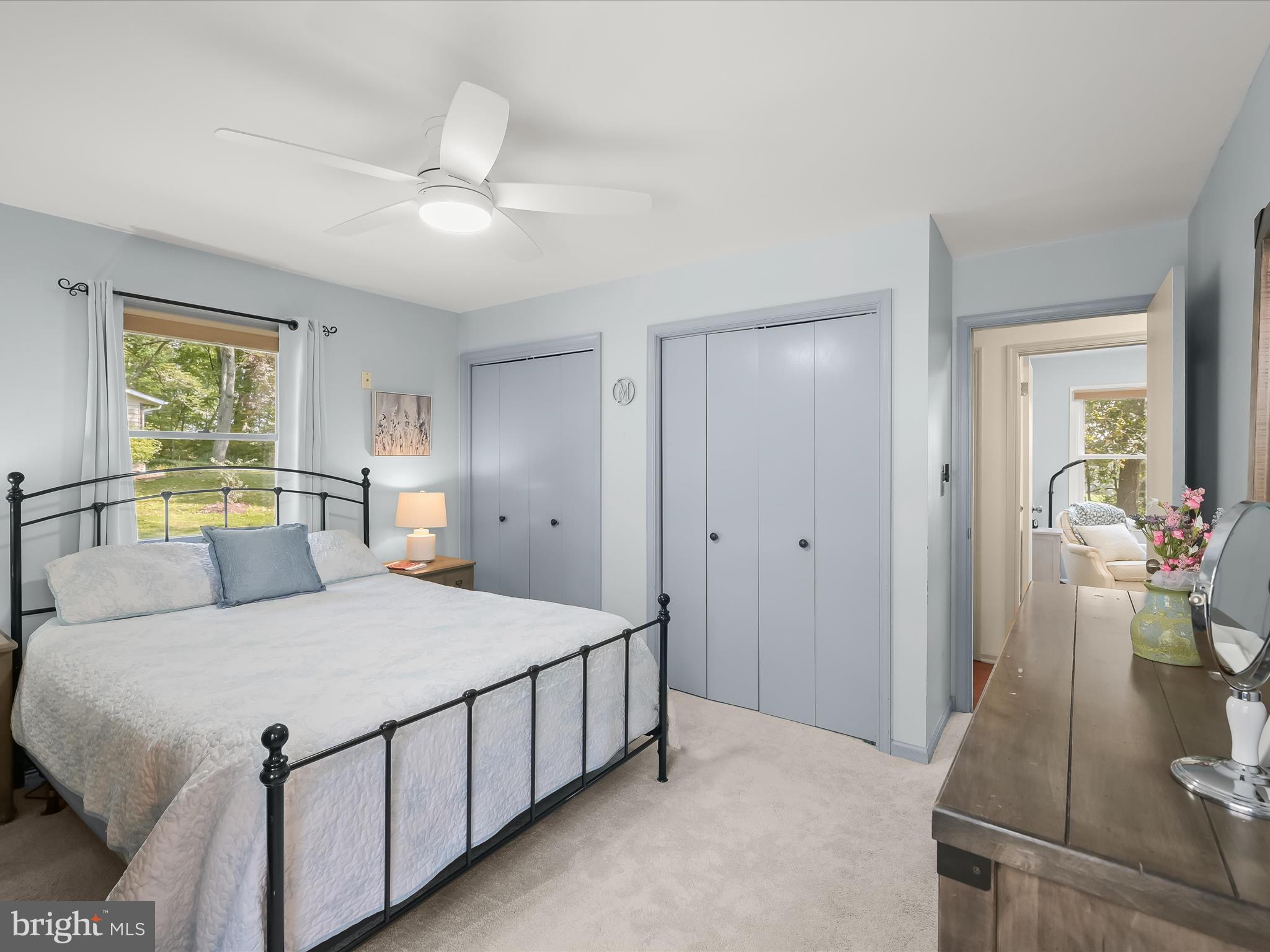 4950 Fleming Road Mount Airy, MD 21771 - Photo 26 of 64 a bedroom with a large bed and a chandelier