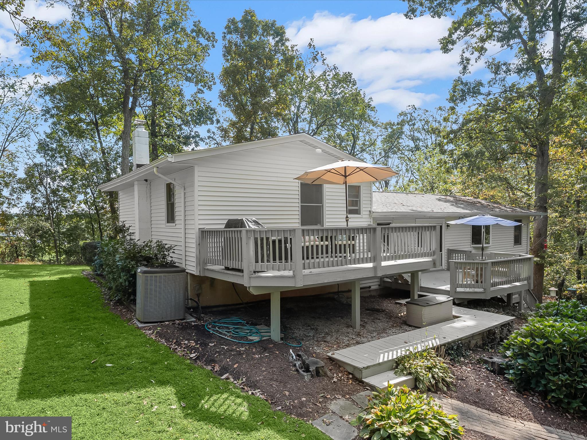 4950 Fleming Road Mount Airy, MD 21771 - Photo 4 of 64 a view of a house with a backyard and a patio