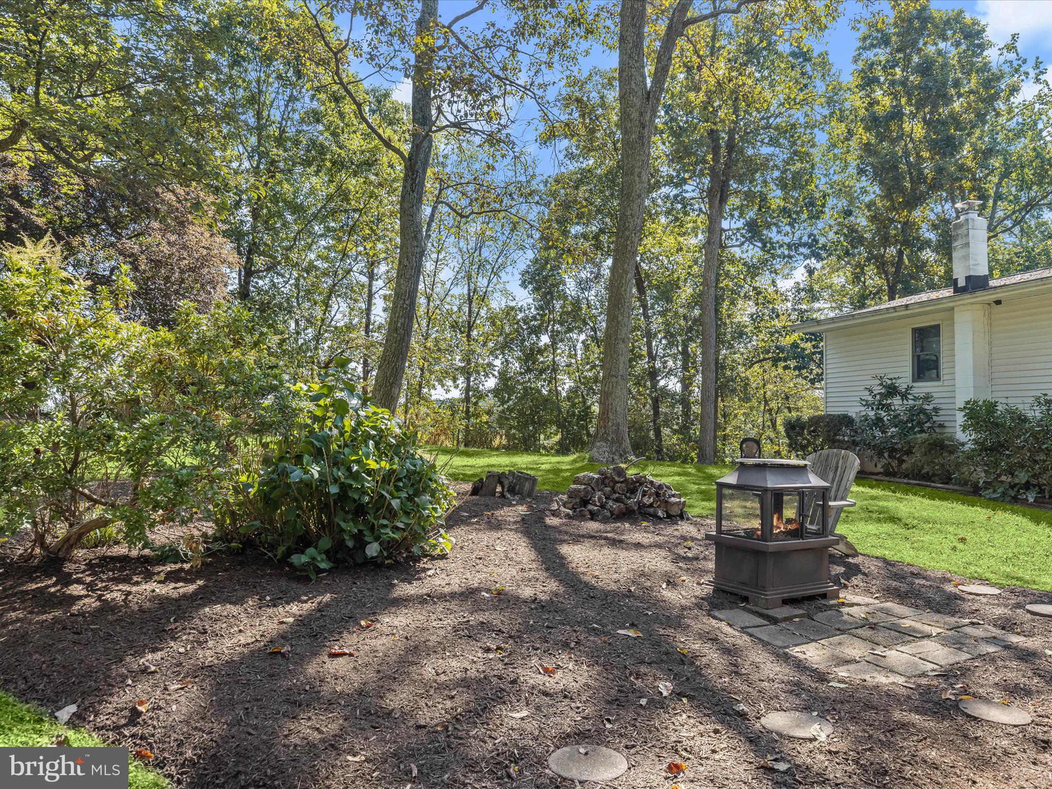 4950 Fleming Road Mount Airy, MD 21771 - Photo 55 of 64 a wooden bench sitting in the middle of a park