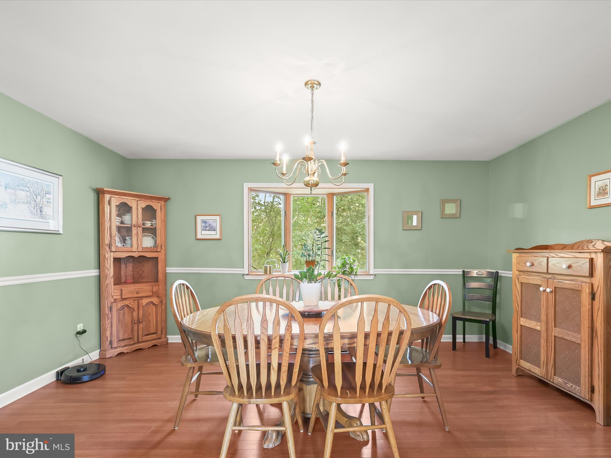 4950 Fleming Road Mount Airy, MD 21771 - Photo 5 of 64 a dining room with furniture a chandelier and wooden floor