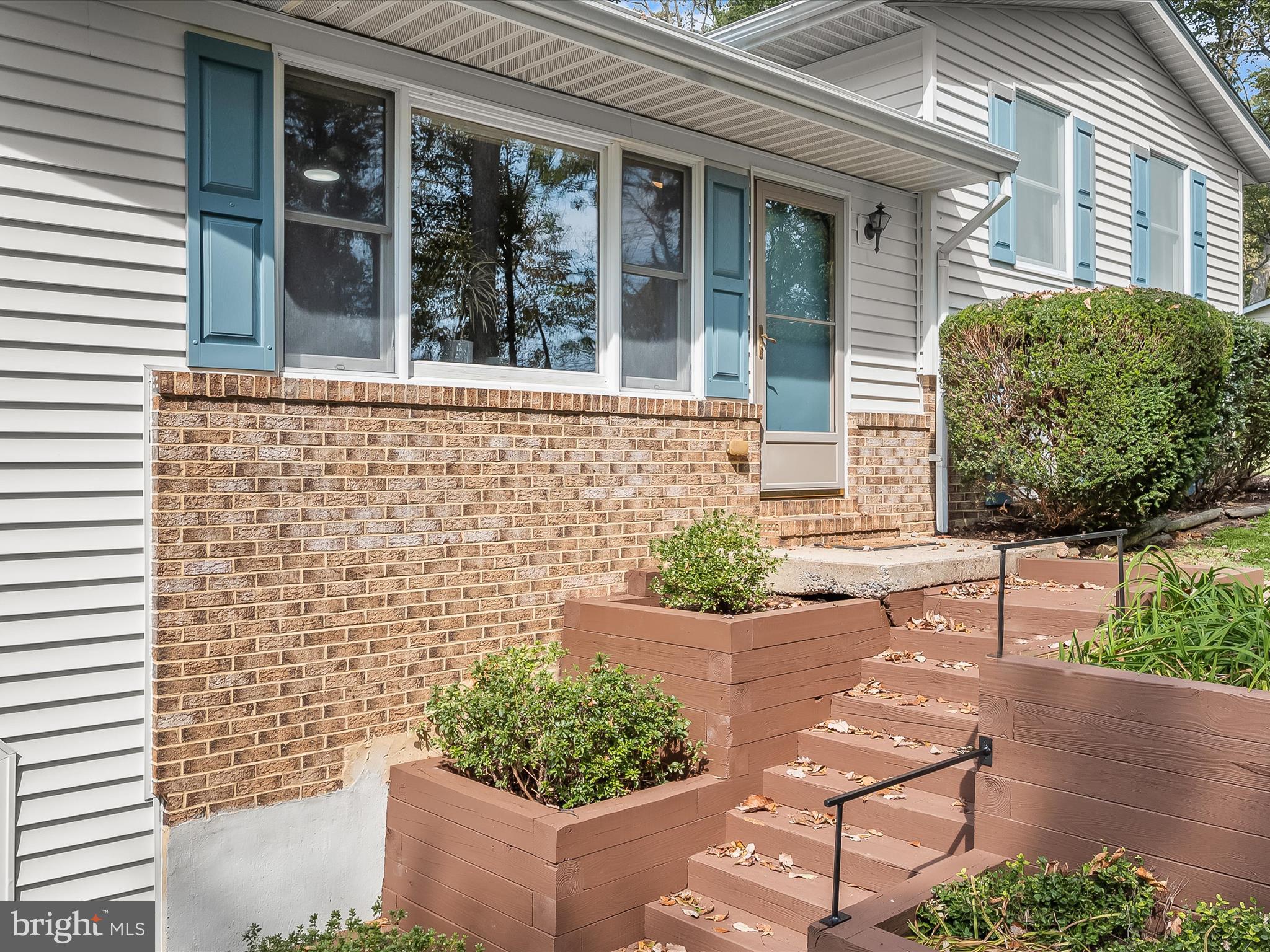 4950 Fleming Road Mount Airy, MD 21771 - Photo 9 of 64 front view of a brick house with a large window