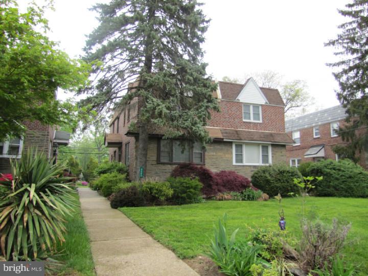 8503 Lynnewood Road Philadelphia, PA 19150 - Photo 1 of 20 a front view of house with yard and green space