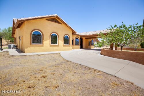 480 Camino Ramanote Rio Rico, AZ 85648 - Photo 24 of 43 Three south facing windows on from the large family room and circular drive. .