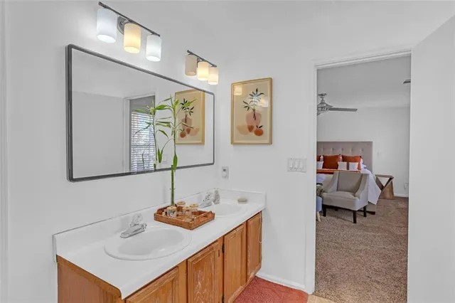 a en suite bathroom with a sink and a mirror