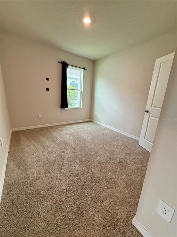 3222 Bitterroot Lane Bradenton, FL 34211 - Photo 27 of 34 an empty room with windows