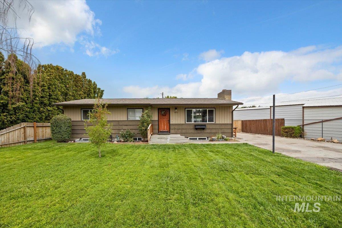 Ranch-style home with a chimney