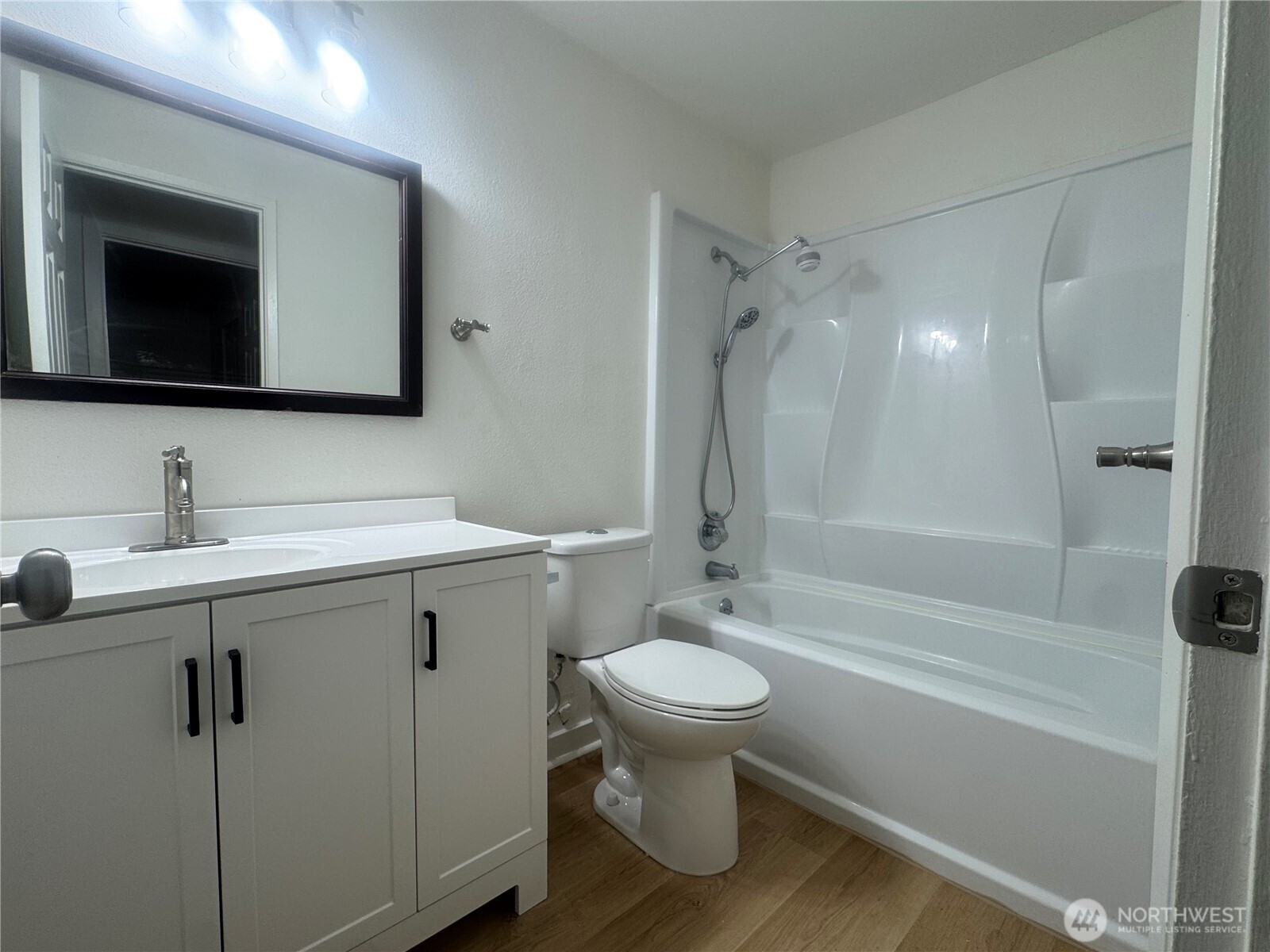 14600 Southeast 176th Street, Unit W11 Renton, WA 98058 - Photo 3 of 8 a bathroom with a sink toilet and shower