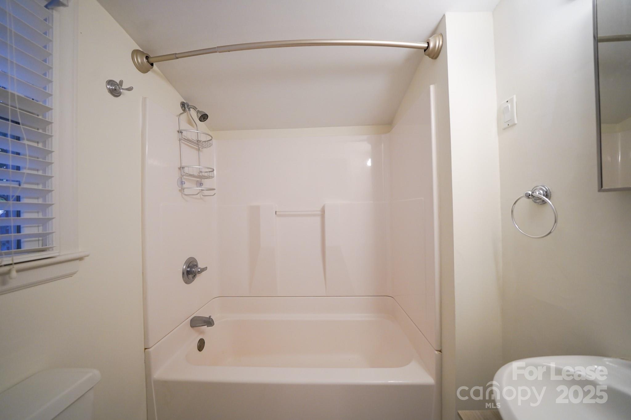 179 North Canterbury Road Charlotte, NC 28211 - Photo 11 of 15 a bathroom with a bathtub and shower