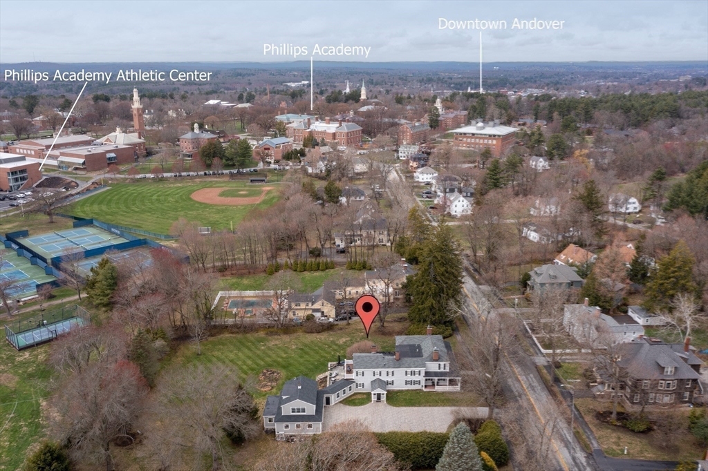 53 Salem Street Andover, MA 01810 - Photo 2 of 41 an aerial view of a city with lots of residential buildings ocean and mountain view in back