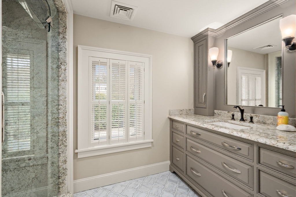 53 Salem Street Andover, MA 01810 - Photo 34 of 41 a bathroom with a granite countertop sink mirror and double