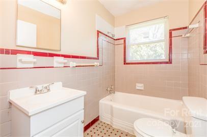 1714 Club Road, Unit 6 Charlotte, NC 28205 - Photo 12 of 14 a bathroom with a sink a toilet and bathtub